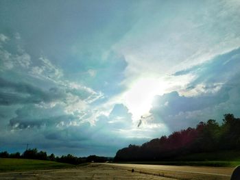 Scenic view of landscape against cloudy sky