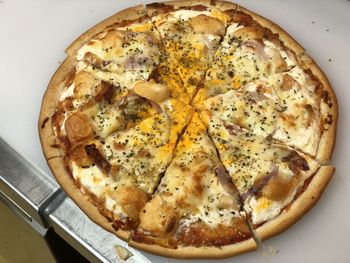 High angle view of pizza in plate on table