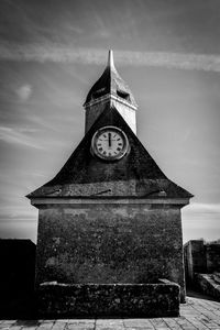 Low angle view of clock tower against sky