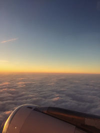 Aerial view of sea against sky during sunset