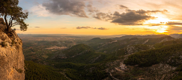 Scenic view of mountains against sky during sunset