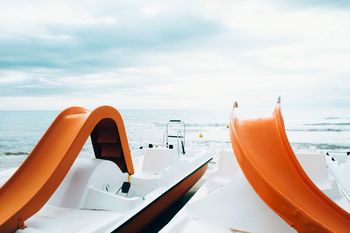 Nautical vessels moored on sea
