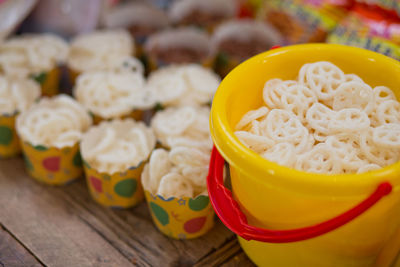 Close-up of snacks in bucket on table