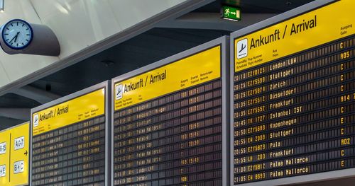 Low angle view of illuminated information sign