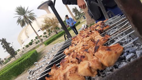 High angle view of people on barbecue grill