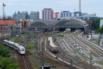 High angle view of railroad tracks in city against sky