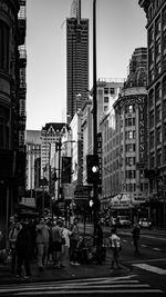 Group of people walking on city street