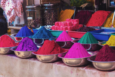 Multi colored powder paint for sale at market stall
