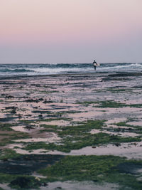 Scenic view of sea against clear sky during sunset