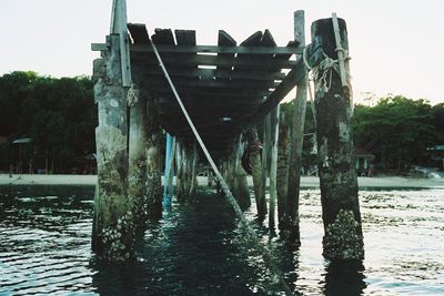 View of pier over river against sky