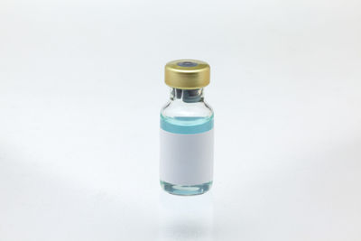 High angle view of bottle against white background