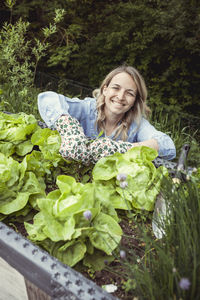 Portrait of smiling woman with vegetables