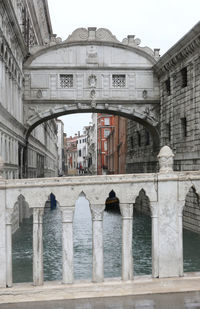 Arch bridge over canal in city