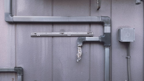 Close-up of pipes on wall