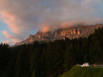 Scenic view of mountains against cloudy sky