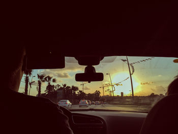 Car on road at sunset