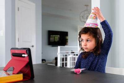 Little girl celebrating a birthday over zoom
