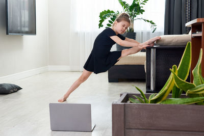 Girl stretching at home