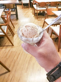 Close-up of hand holding ice cream