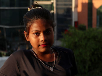 Portrait of young woman looking away