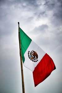 National flag flying against dramatic sky