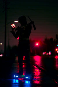 Man walking in dark with ghost mask. neon lights