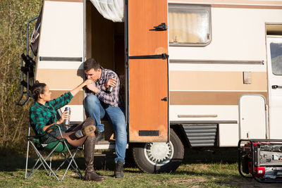 Side view of man using mobile phone