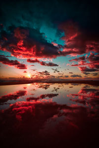 Scenic view of lake against sky during sunset