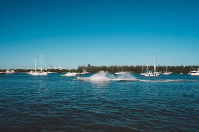 Scenic view of sea against clear blue sky