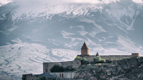 View of building with mountain range in background