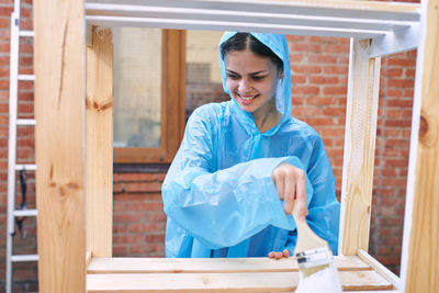 Portrait of young woman working at home