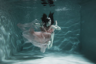 Woman swimming in pool