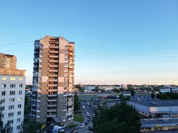 High angle view of buildings against clear blue sky