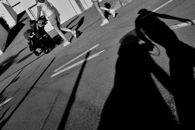 Low section of people on road in city