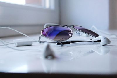 Close-up of sunglasses on table
