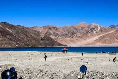 Scenic view of pangon tso lake against clear blue sky