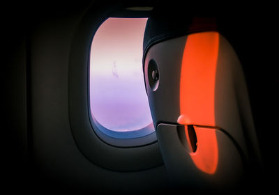 Vehicle seat by window in airplane