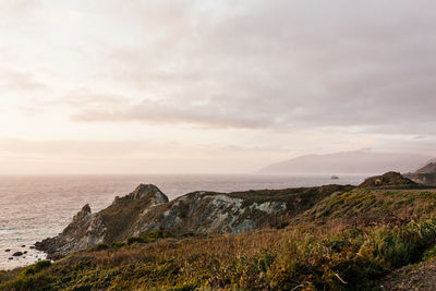 Scenic view of sea against cloudy sky