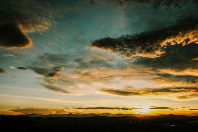 Low angle view of dramatic sky during sunset