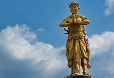 Low angle view of statue against sky