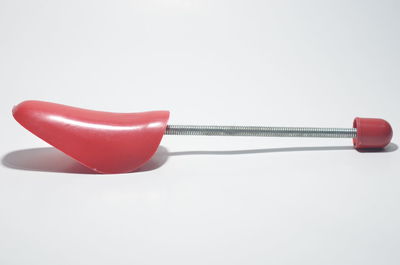 Close-up of red wine against white background