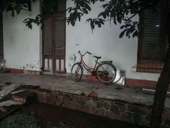 Bicycle against wall of building