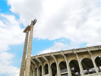 Low angle view of floodlight against sky at stadium