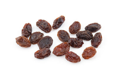 High angle view of raisins against white background