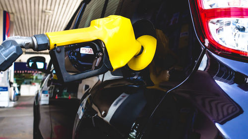 Close-up of yellow motor scooter