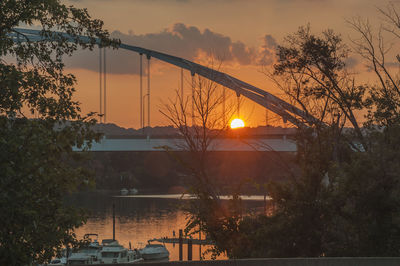 Scenic view of river against orange sky