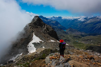 Rear view of man standing on mountains