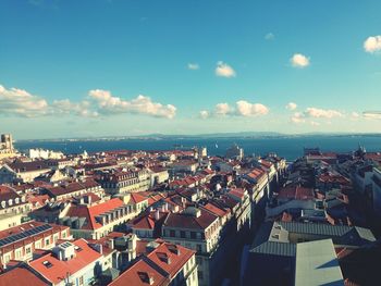 High angle view of city against cloudy sky