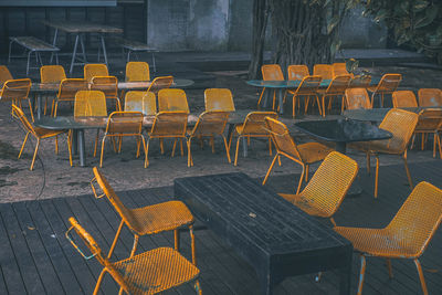 High angle view of chairs and tables at sidewalk cafe