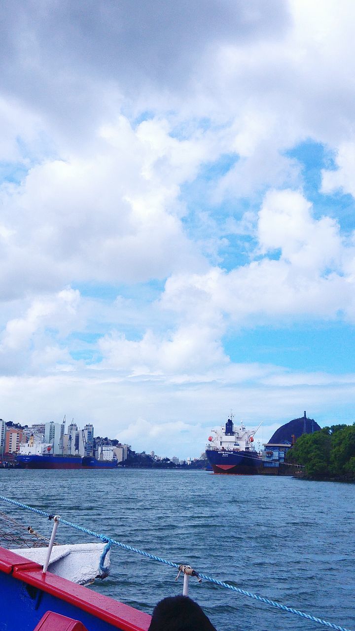 nautical vessel, transportation, water, sky, cloud - sky, mode of transportation, architecture, building exterior, day, built structure, sea, city, nature, waterfront, travel, no people, outdoors, travel destinations, cityscape, passenger craft, yacht, cruise ship